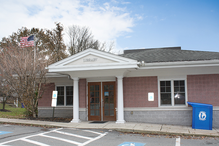 exterior photo of Wernersville Public Library building, bright blue sky