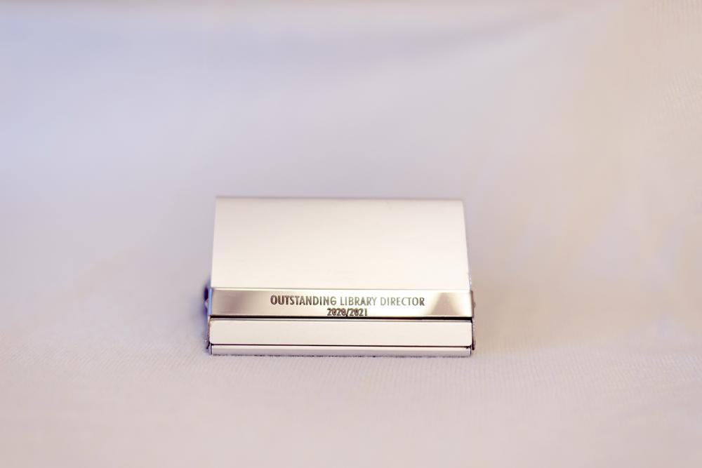 silver metal business card holder with library director engraving