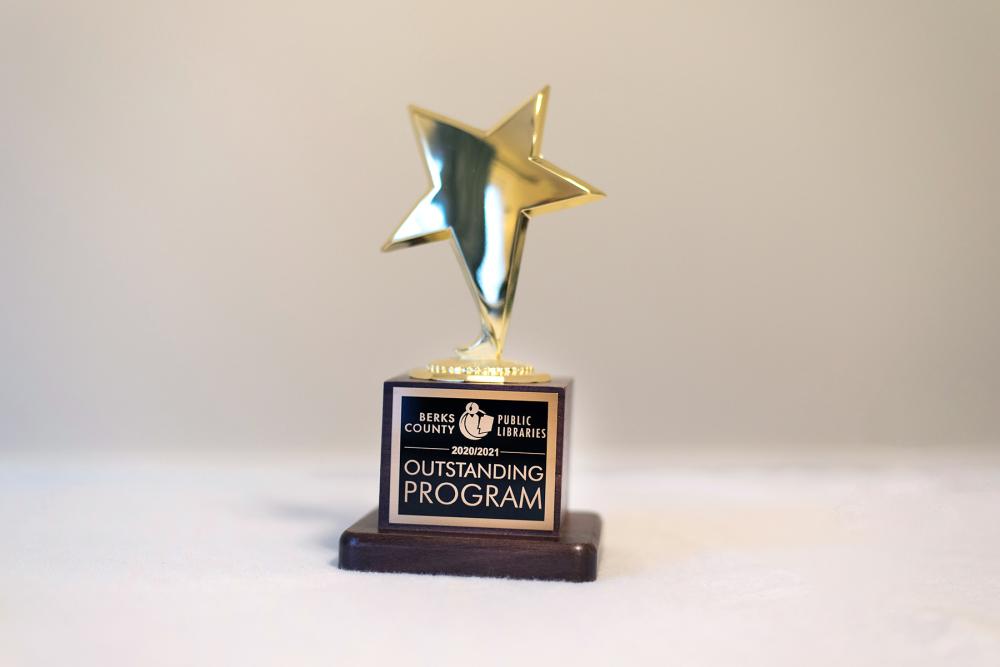 golden star trophy with outstanding program engraving
