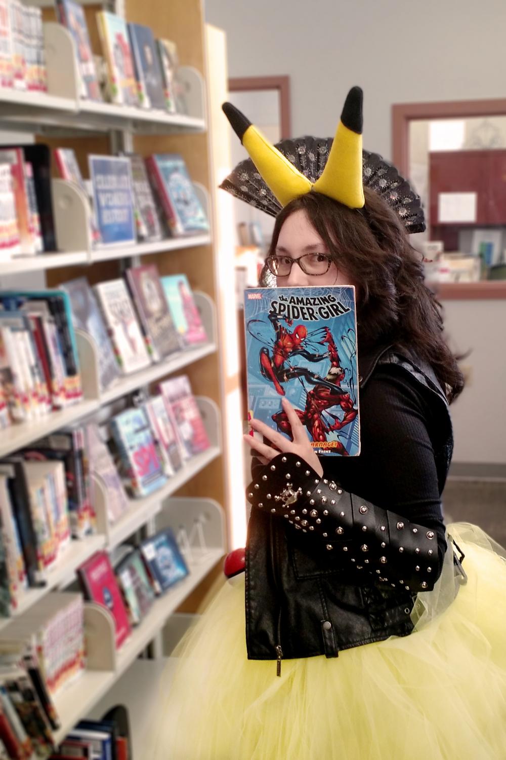 girl cosplay pikachu in library holding book