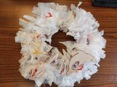 plastic bag wreath with dolphin cutout, anchor cutout and starfish