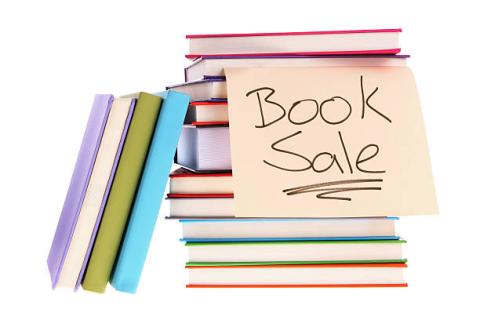 books and hand written sign "book sale"
