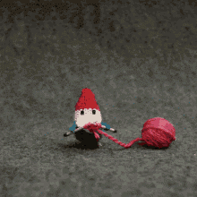 gif of gnome knitting a heart