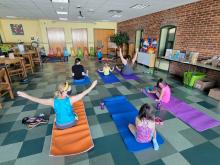A Family participating in Yoga with instructor Diane Nolfe