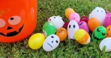 Plastic eggs in the grass decorated for Halloween